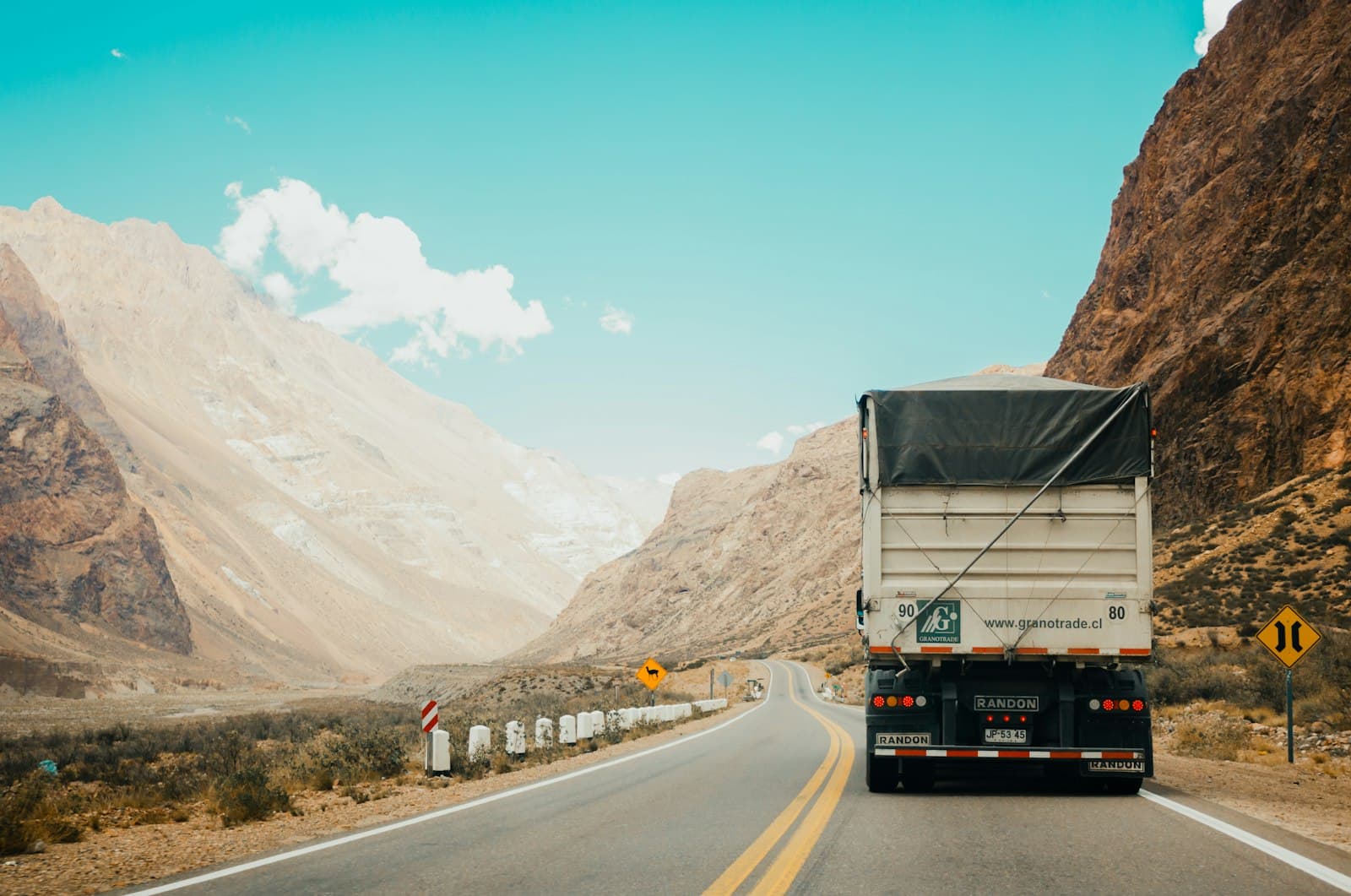 Truck driving through a mountain pass