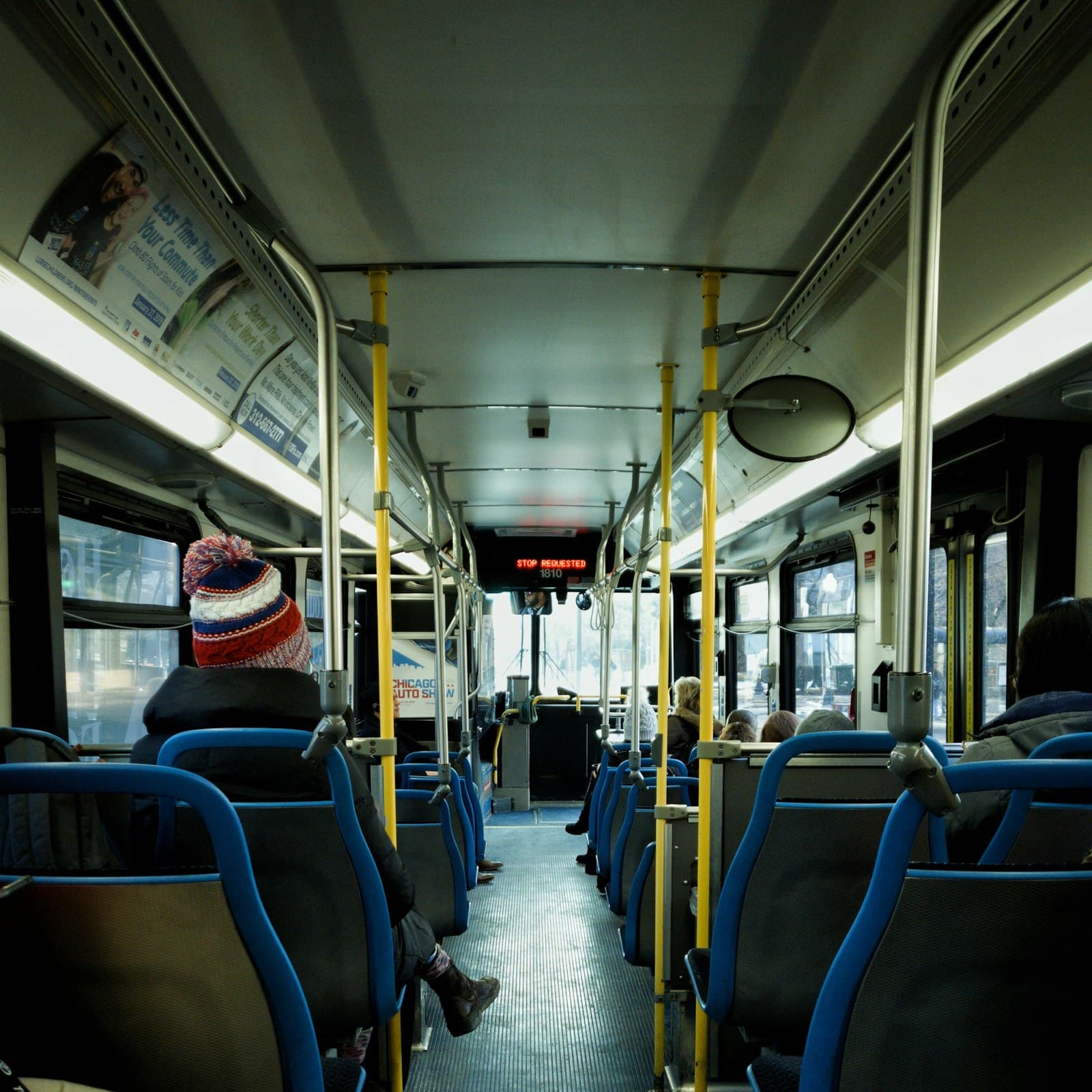Interior of a city bus with passengers seated