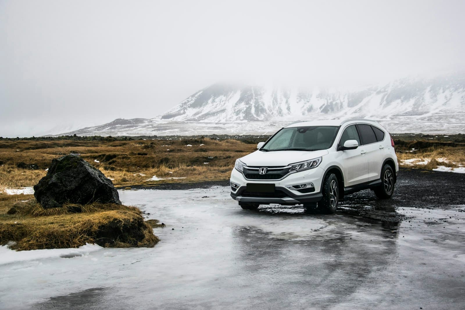 Rental SUV parked in a mountain landscape