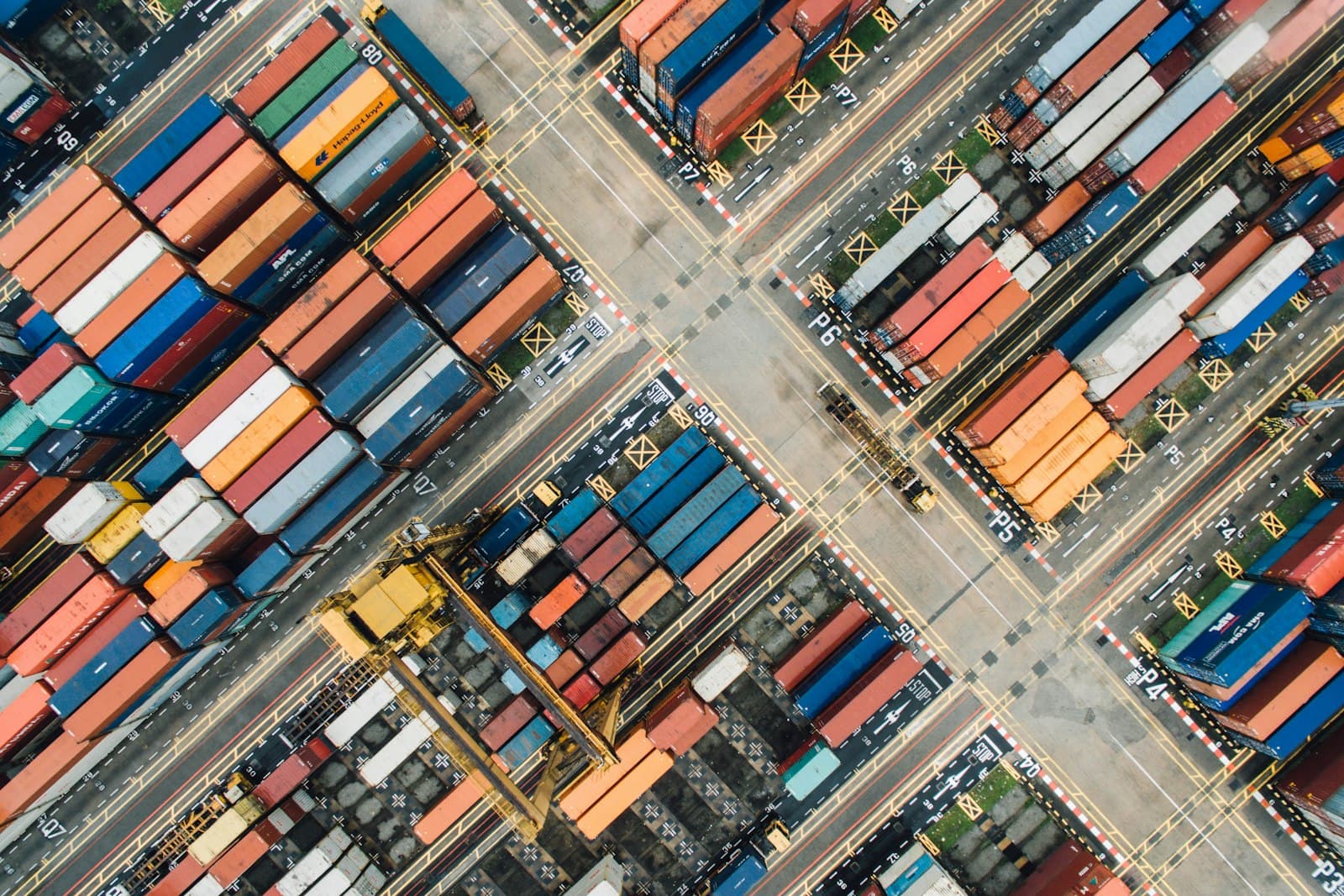 Aerial view of a shipping container yard laid out in zones