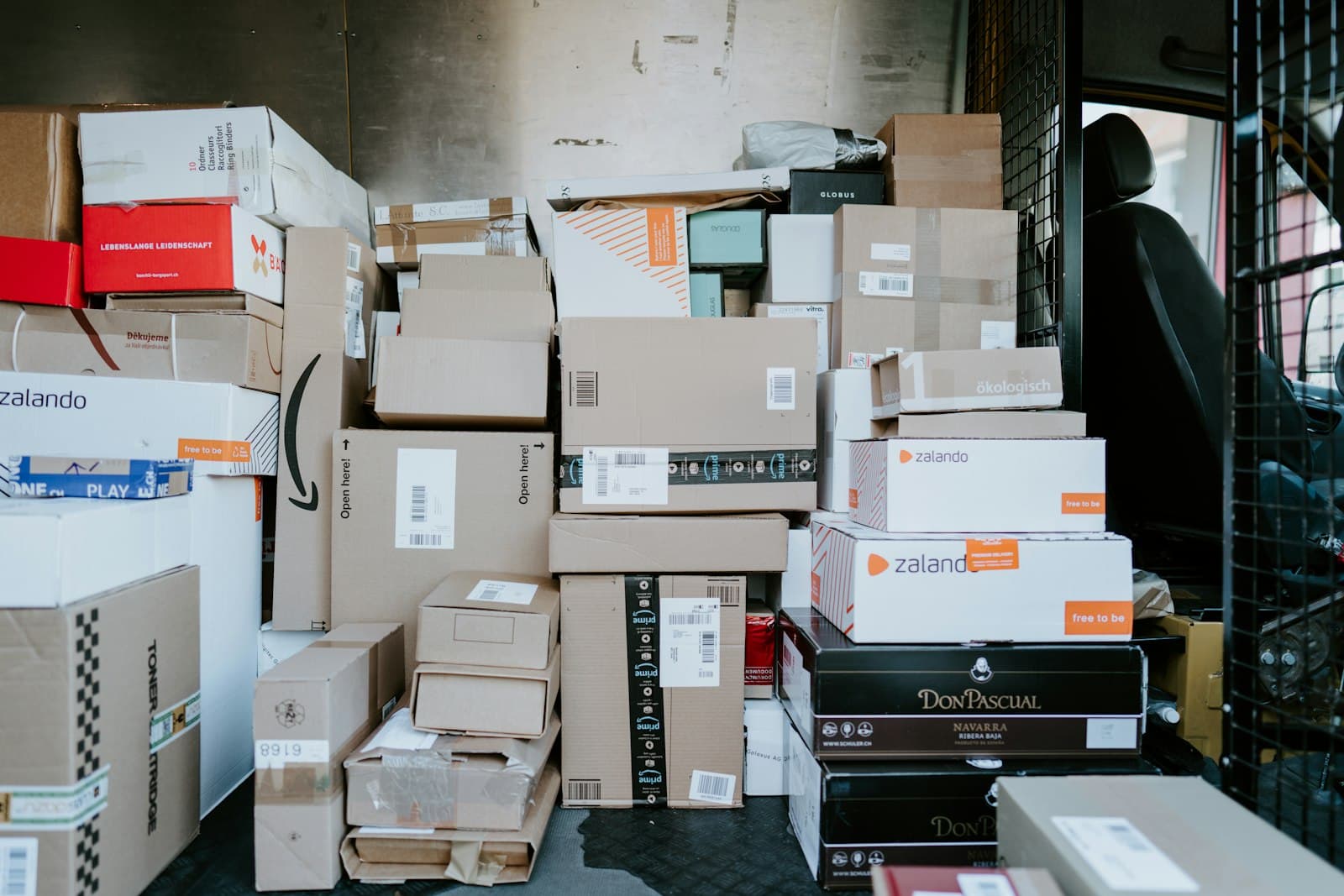 Interior of a delivery van packed with parcels