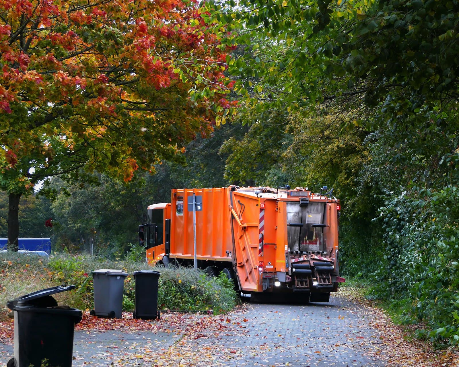 Garbage truck parked on the side of a street