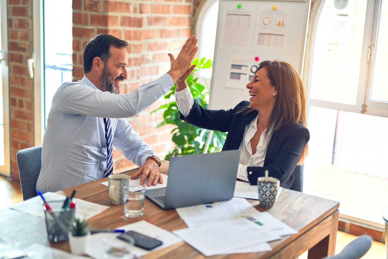 Colleagues shaking hands in an office