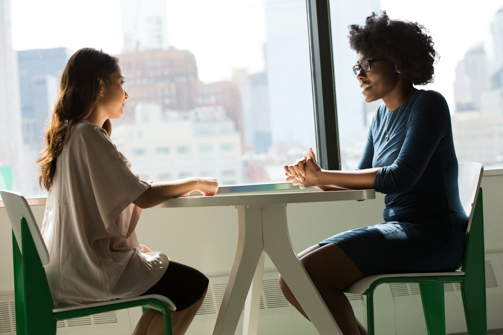 Two colleagues talking in an office