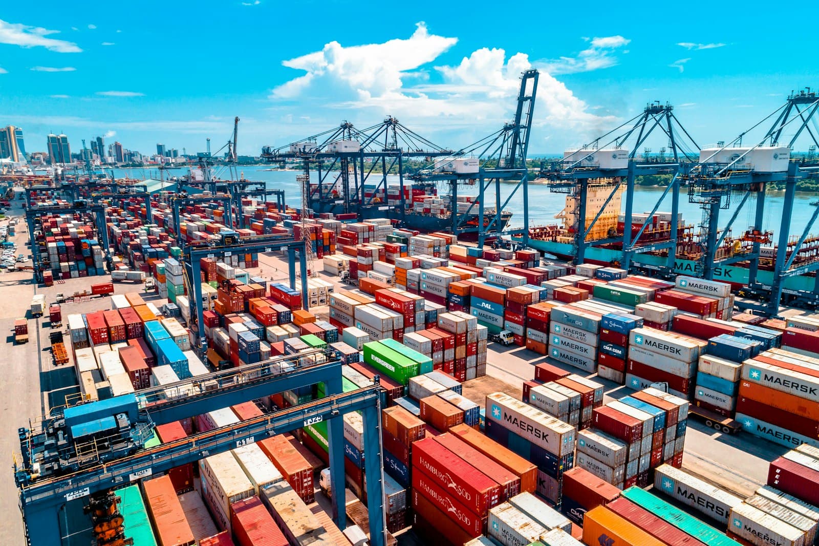 Large stacks of shipping containers at a port