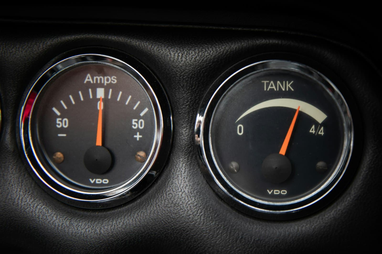 Close-up of a vehicle fuel gauge showing a full tank