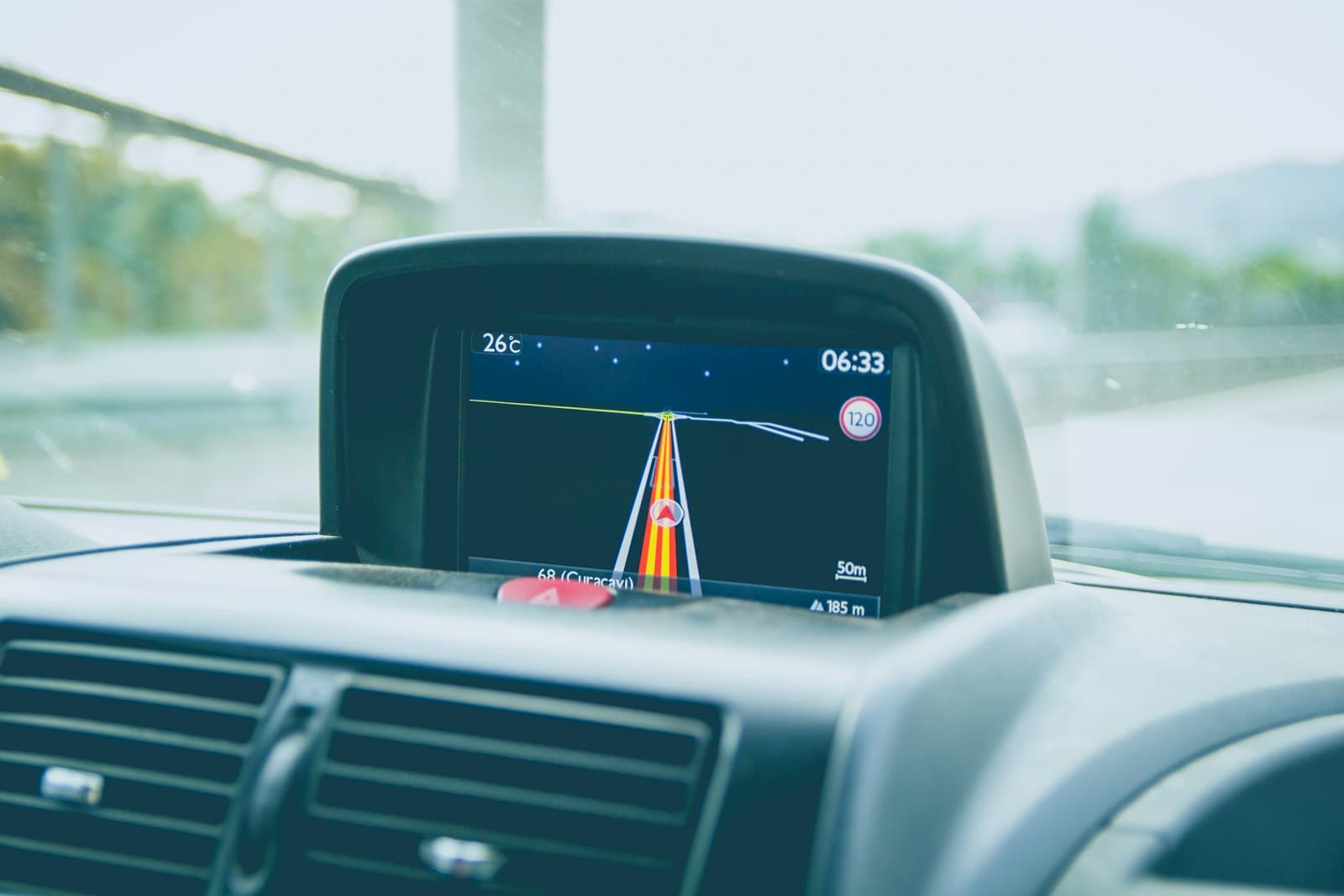 In-dash GPS navigation screen showing a route and speed limit